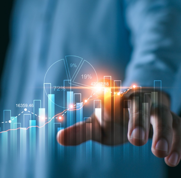 A hand reaches towards a glowing graph displaying a line chart, bar graphs, and pie chart, illustrating data visualization and analytics.